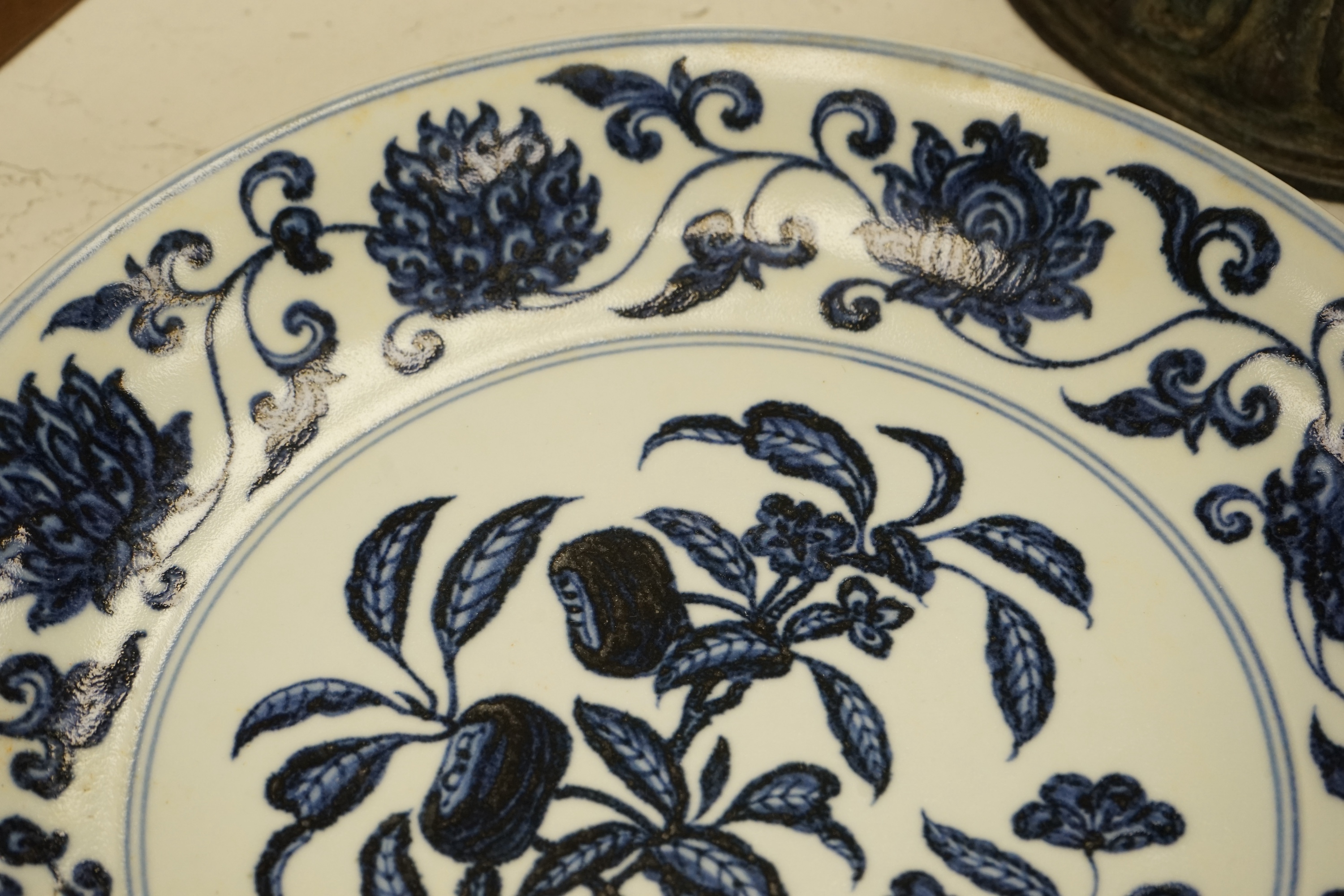 A Chinese blue and white pomegranate dish, 33cm diameter, Condition - firing crack to surface of dish